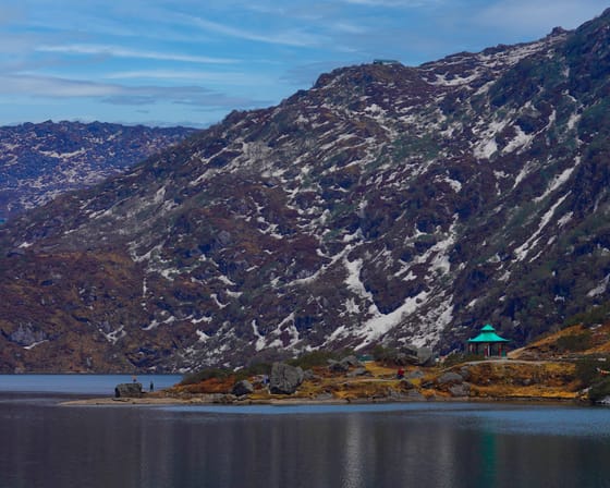 Amazing Beauty of Khangchendzonga — The high alpine water of Tsomgo Lake in East Sikkim below bare ridges